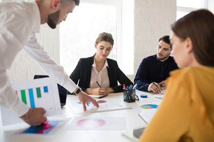 Group of creative people working tog stock photo containing white interior