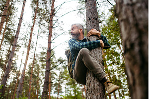 Frightened man is hiding from bear, a Sports & Recreation Photo by HalfPoint