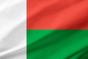 Madagascar flag background with waving fabric texture