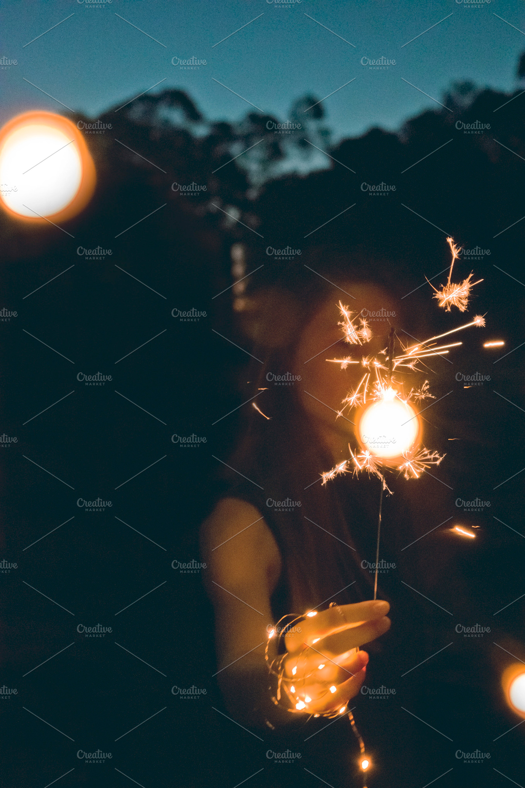 Girl holding sparkler featuring silhouette, black, and dark, a Person Photo by Fossilized Tree Sap