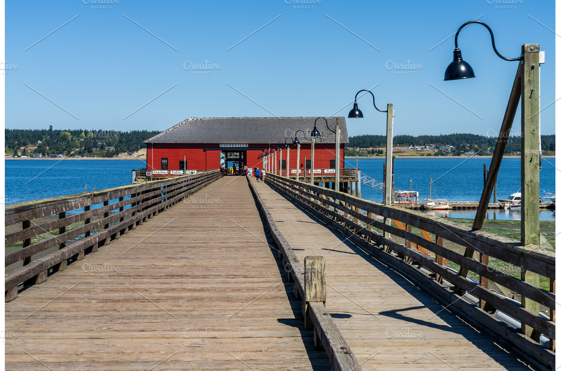 Wooden pier leading to famous red, an Architecture Photo by Backyard Stock