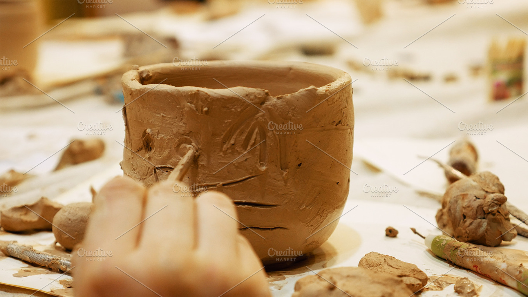 Ceramist is modeling clay pot, a Photo by HighRes Pictures