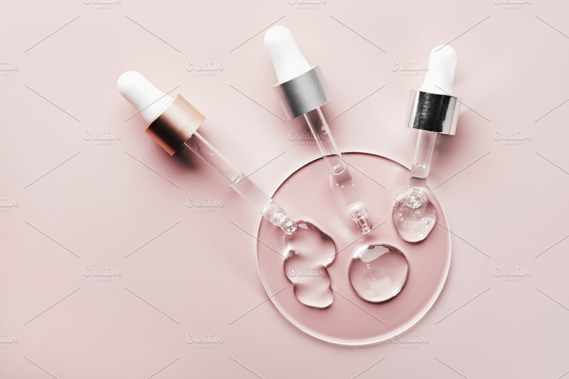 Three pipettes with different samples of gels cosmetic products in petri dish o, a Beauty & Fashion Photo by colnihko