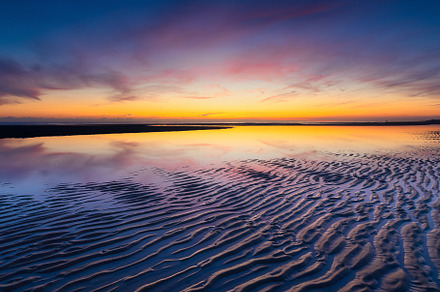 A seascape during sunset