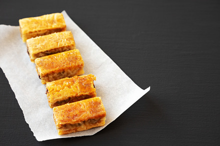 Homemade Baklavas with Honey, Chocolate and Almond on a black ba, a Food & Drink Photo by LiudmylaChuhunova