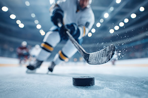 Dynamic hockey player in action on ice, a Sports & Recreation Photo by AlyaAnd