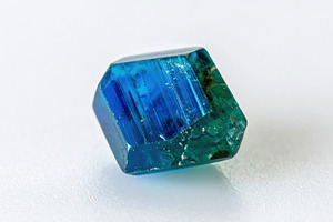 Single tourmaline crystal mineral specimen on white
