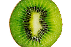 Slice of kiwi isolated on white, a Food & Drink Photo by BOOCYS