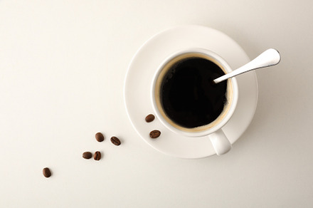 Cup of coffee and beans on white background top view, a Food & Drink Photo by Davizro's Market
