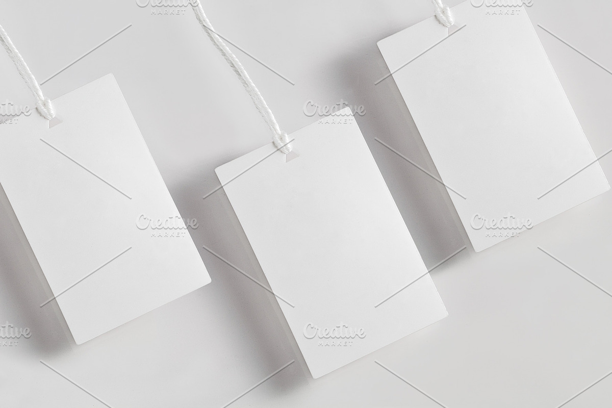 Clothes label tag blank white mockup, an Advertising Mockup by Olha Klein (Photo 2 of 3)