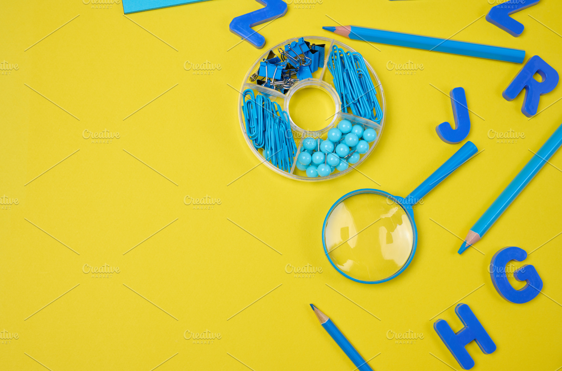 Assortment of blue stationery, letters, paper clips, and supplie, a School & Education Photo by ndanko