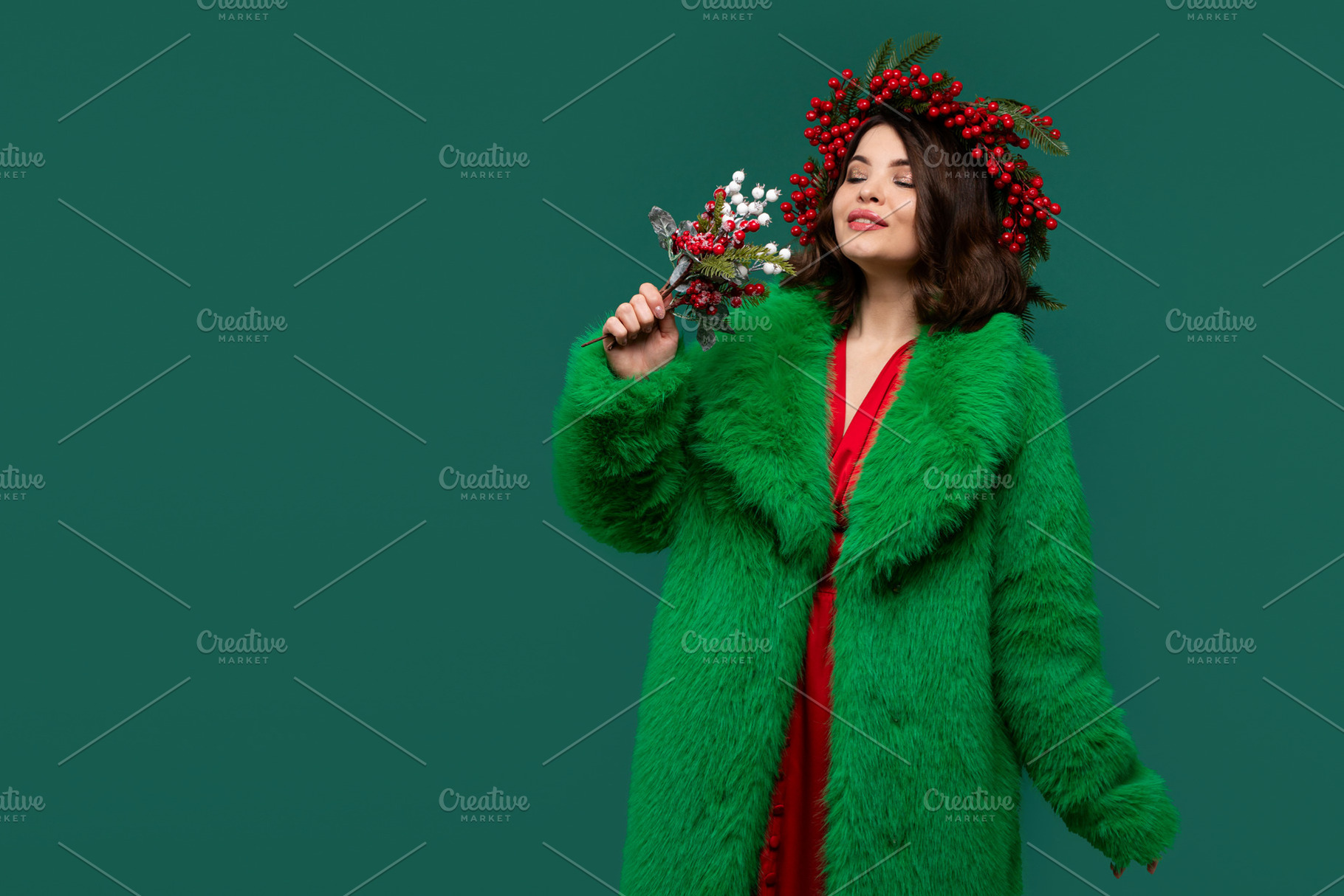Woman in green coat and red berry, a Person Photo by Elena Vagengeim