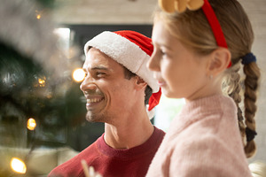 Father and daughter enjoying Christmas together, a Person Photo by etorres69