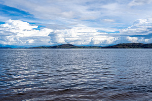 View of Lake Titicaca from Llachon with distant islands and hill, a Nature Photo by GoodGoods