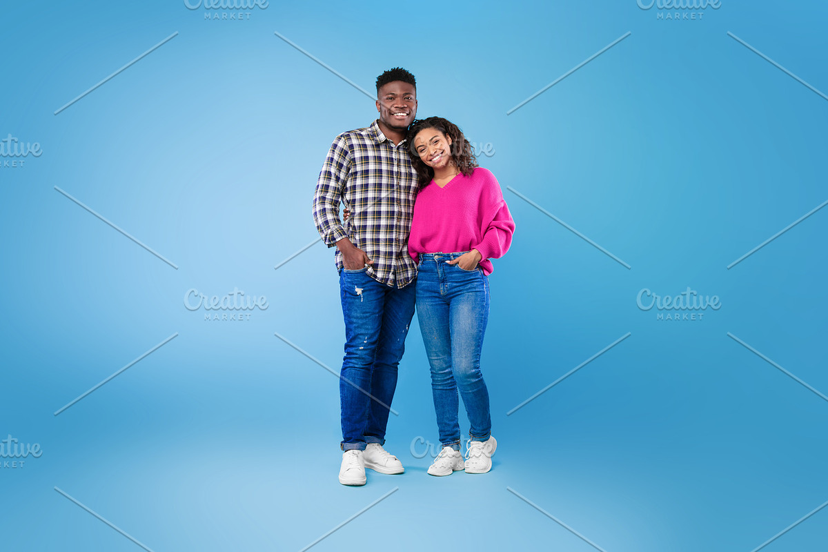 Full length of happy young African American couple in casual wear hugging and l, a Photo by Prostock-Studio (Photo 2 of 2)