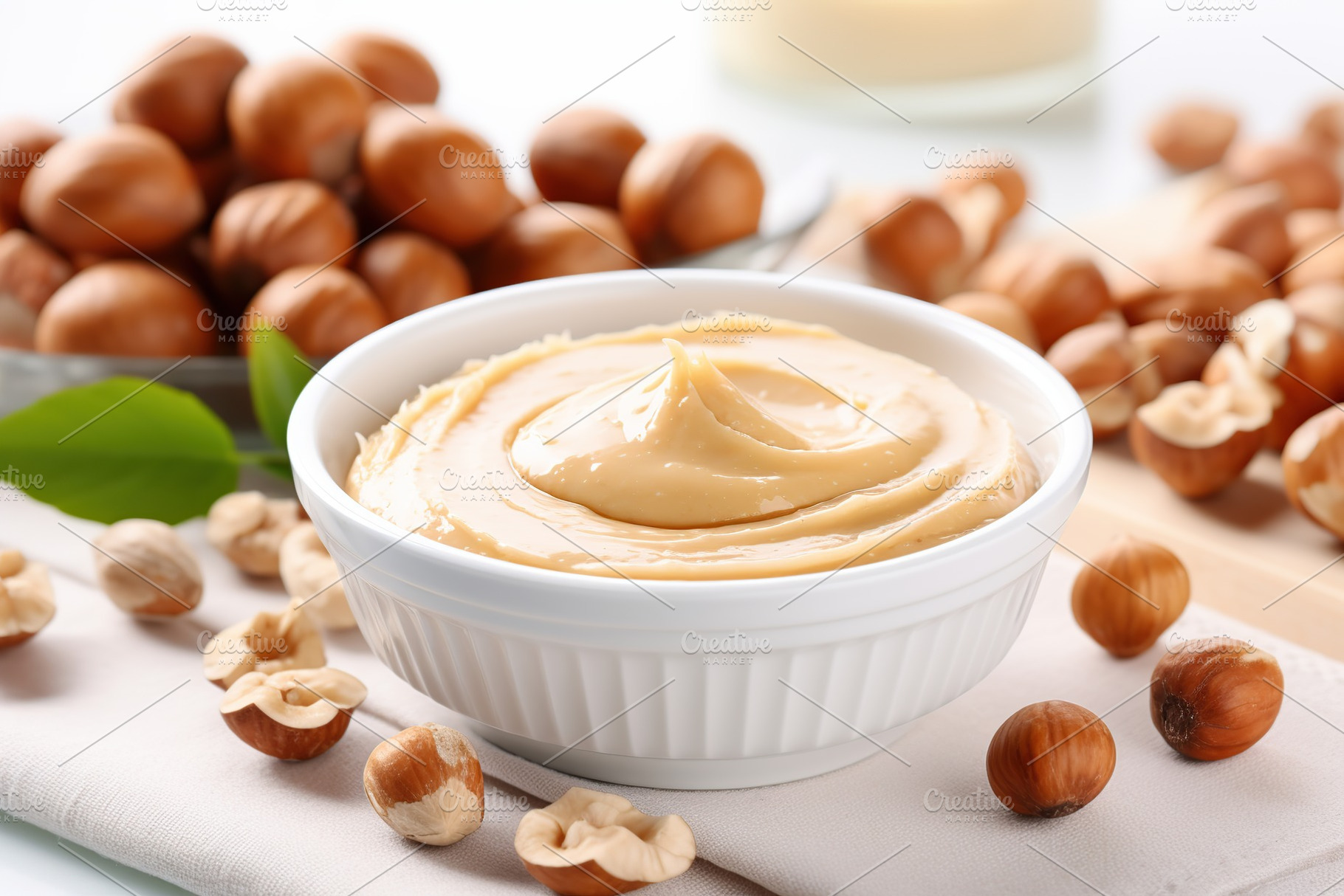 Bowl of hazelnut butter on white background, a Food & Drink Photo by AlyaAnd