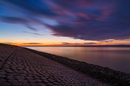 A seaside sunset during sunset, a Nature Photo by Landscape and travel