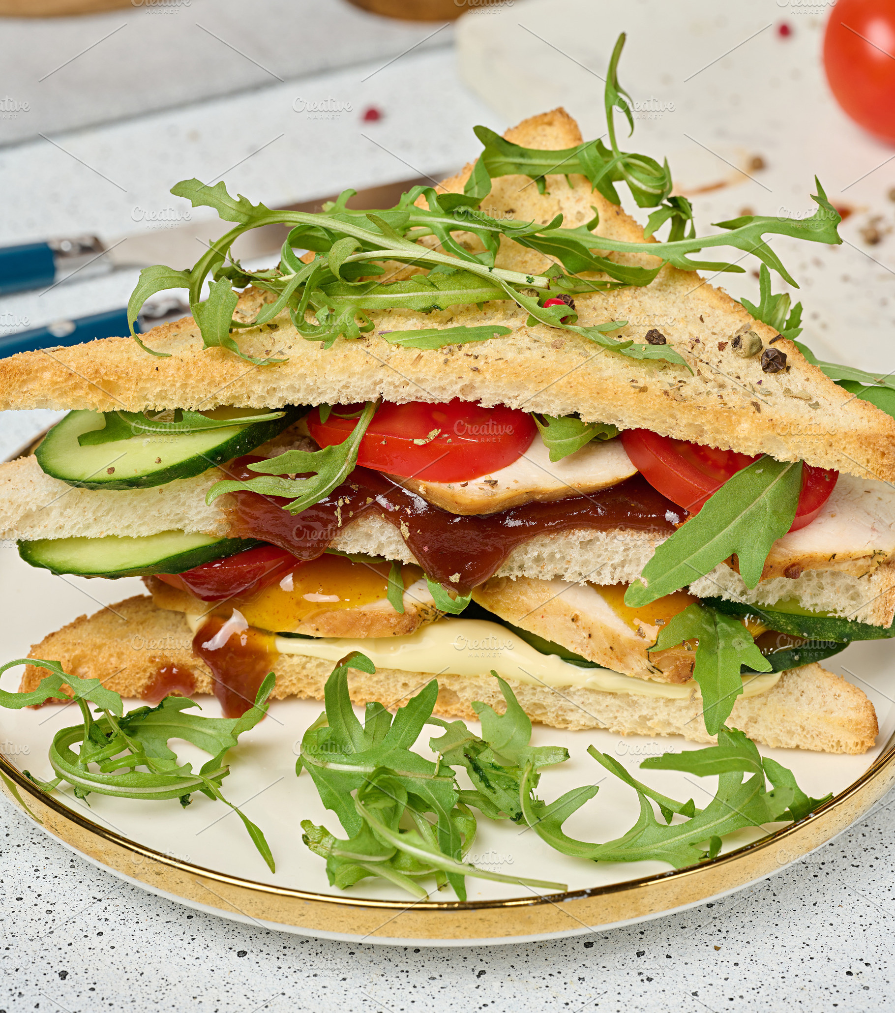 Sandwich with grilled chicken, fresh cucumber, tomato, arugula a, a Holiday Photo by ndanko