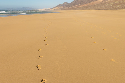 Footprints in sand on Cofete beach