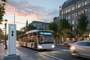 Urban street scene with bus and charging station at dusk, a Transportation Photo by AlyaAnd