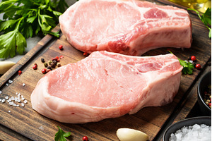 Raw pork meat on cutting board with, a Food & Drink Photo by Nadia-nb