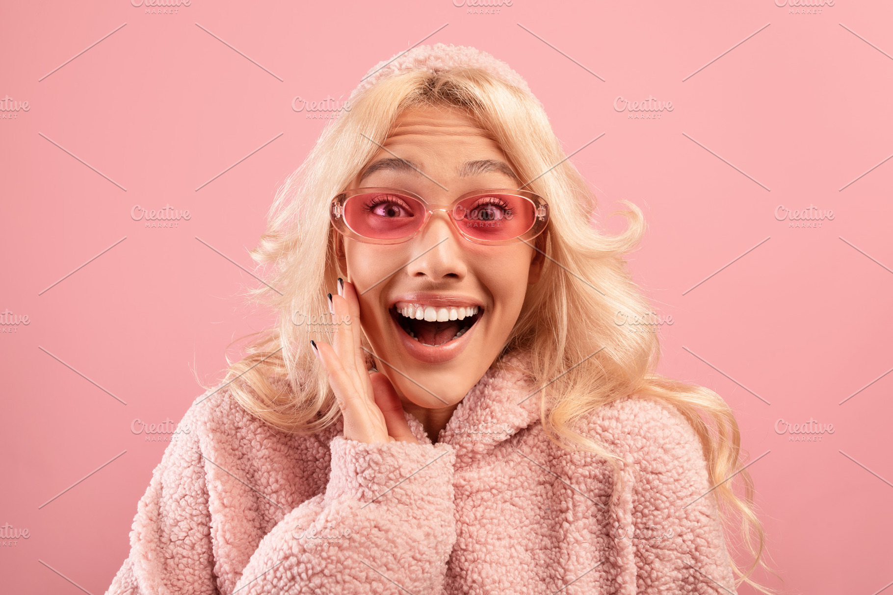Breathtaking advertisement. Surprised stylish lady with hand on cheek looking a, a Photo by Prostock-Studio