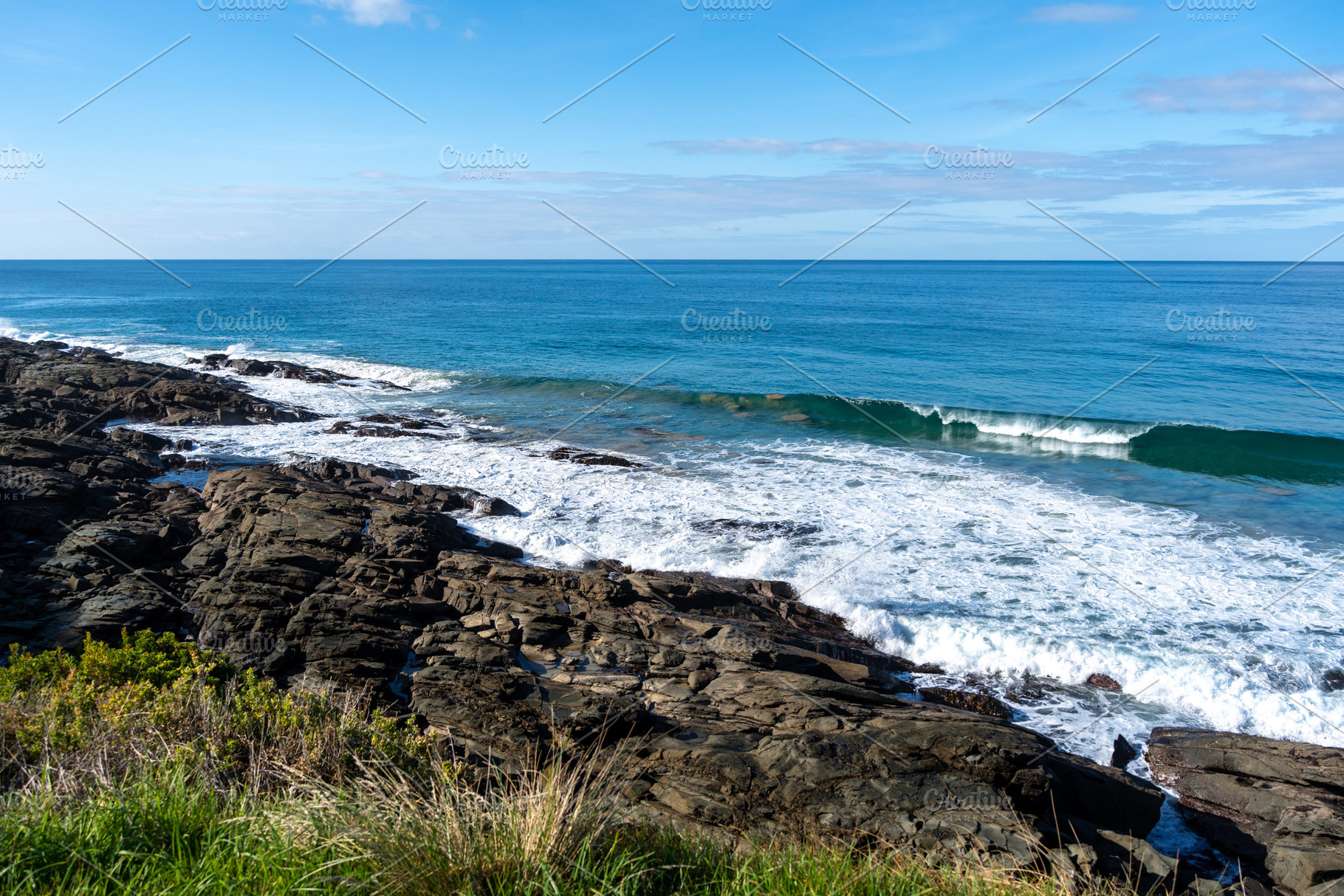 Rocky coastline along the Great Ocean Road in Australia with wav, a Nature Photo by GoodGoods