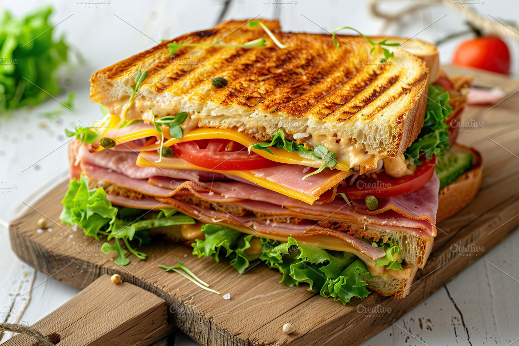 Toast sandwich with cheese, turkey ham, tomato and fresh lettuce on wooden back, a Food & Drink Photo by AlyaAnd