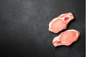 Raw pork meat steaks on black, a Food & Drink Photo by Nadia-nb