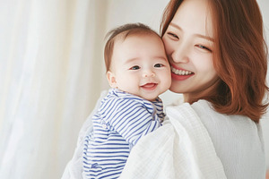 Newborn korean baby in arms of mother, a Photo by Dvoevnore photos