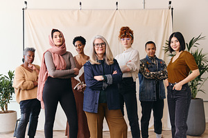 International Women's Day portrait of multi ethnic mixed age range women lookin