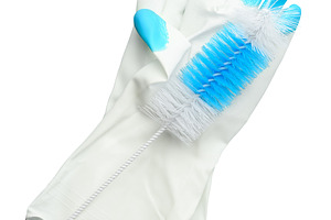 White rubber household gloves and cleaning brush, isolated backg, an Industrial Photo by ndanko