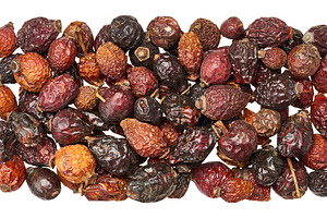 Scattering of dried rosehip fruits with wrinkled skin texture, i, a Food & Drink Photo by ndanko