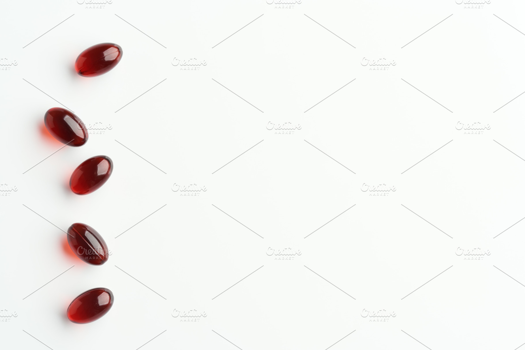 Krill oil capsules on a bright background with copy space, a Food & Drink Photo by Madeleine Steinbach