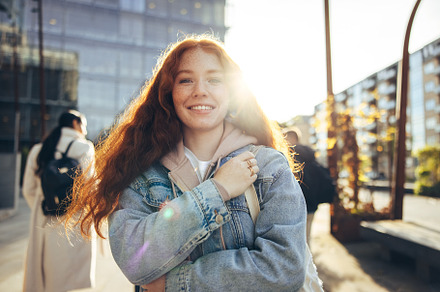 Beautiful girl standing in college campus, a Person Photo by Jacob Lund