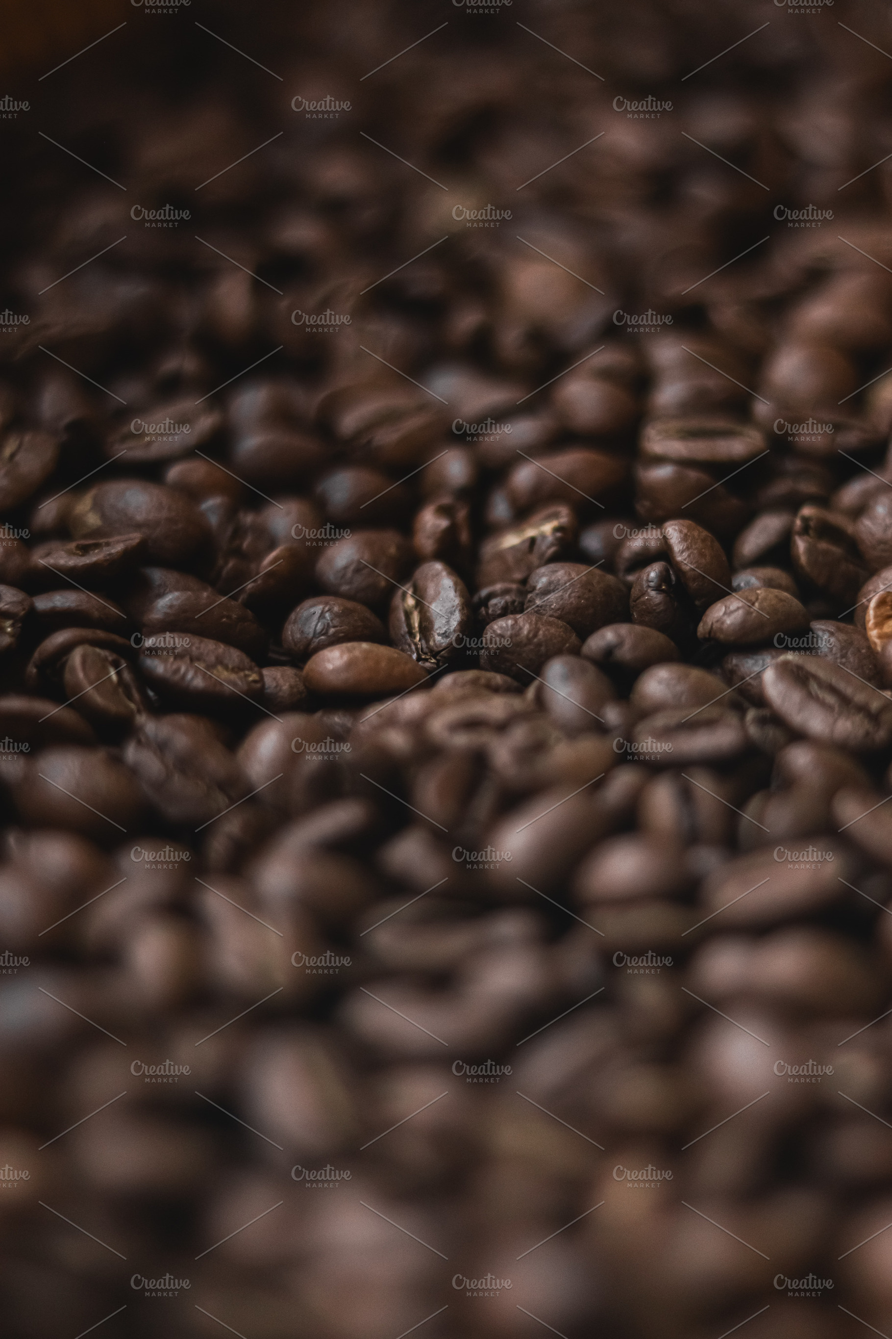 Roasted coffee beans creating a rich texture, offering a brown b, a Photo by Studio ANNA