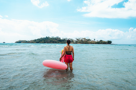 Travel to the sea and islands Woman walking into the clear sea o, a Holiday Photo by Art Rachen