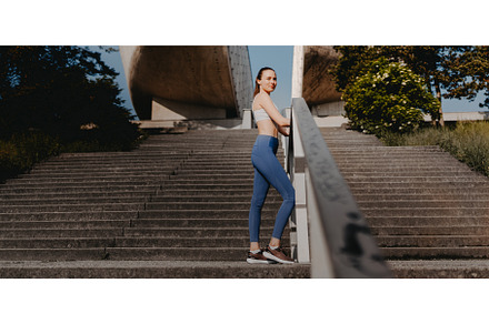Portrait of sporty woman running on, a Sports & Recreation Photo by HalfPoint