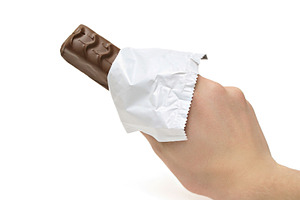 Chocolate bar in the hand, a Photo by saiko3p