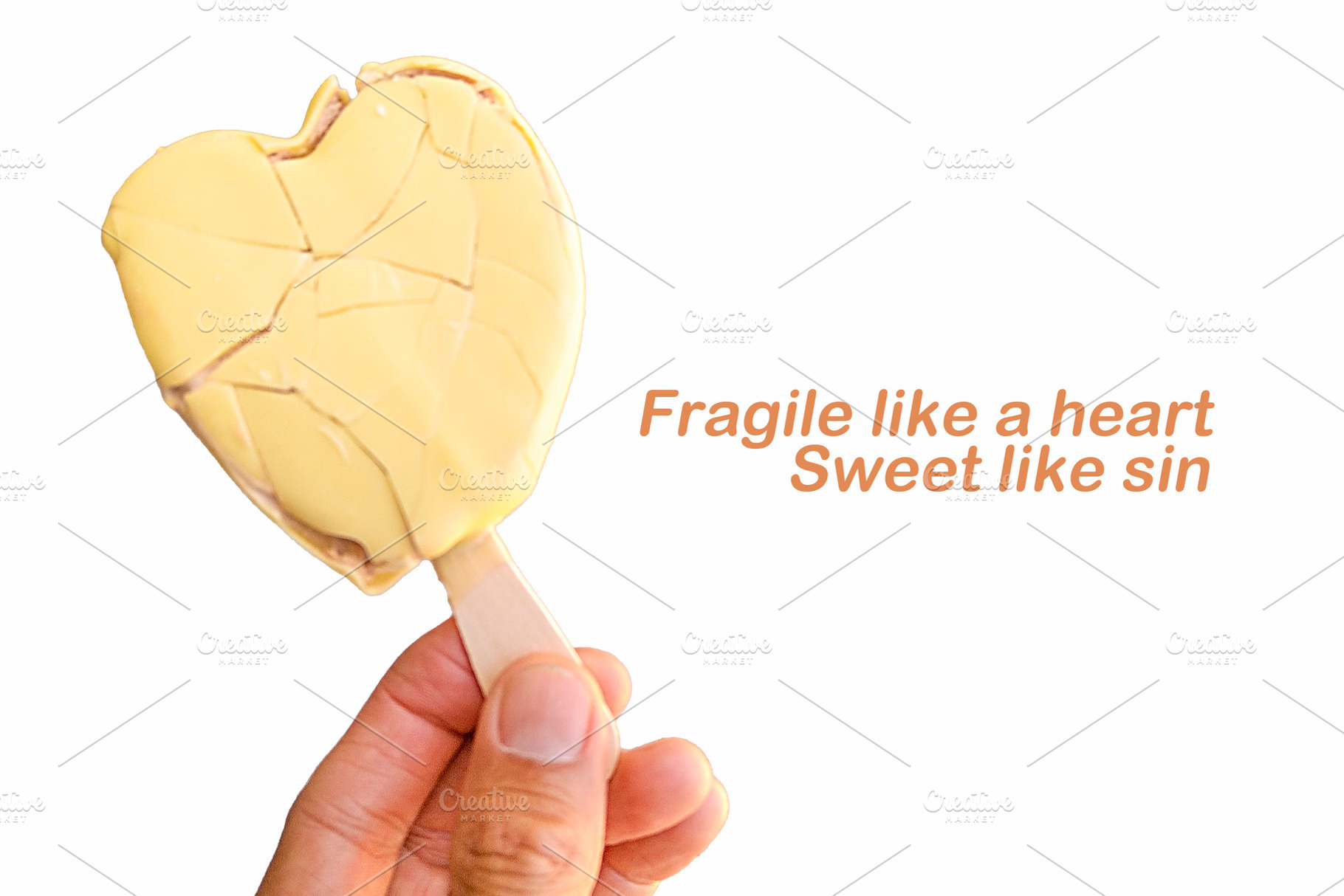 Hand holding heart-shaped lollipop with creative phrase, an Arts & Entertainment Photo by DanFLCreativo