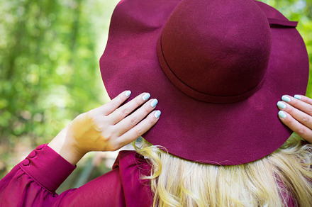 beautiful girl in cherry dress with a hat in the woods., a Person Photo by Artsaba Family