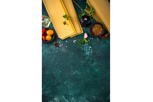 Uncooked lasagna pasta with cooking, a Food & Drink Photo by Yulia Furman
