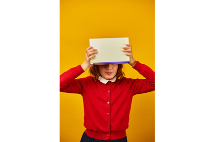 Portrait of happy teenage schoolgirl, a School & Education Photo by IlliaBondarPhotography