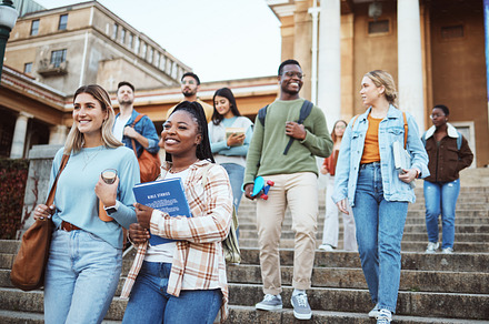 Diversity, students and walking on university steps, school stairs or college campus to morning class. Smile, happy people and bonding education friends in global scholarship opportunity or open day, a Photo by Peopleimages.com