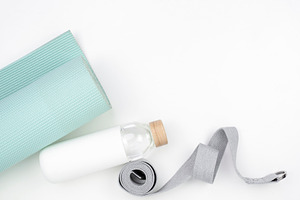 Yoga Mat and Water Stock Image