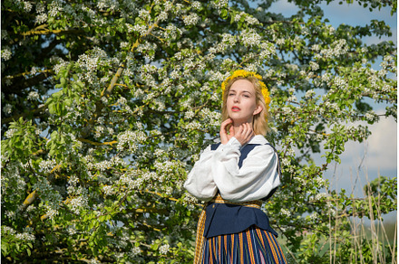 Beautiful feminime woman in national, a Holiday Photo by COLORFUL