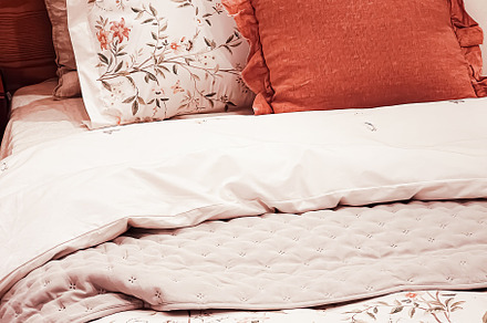 Vintage countryside style bedding with floral pattern on wooden, an Architecture Photo by Anneleven