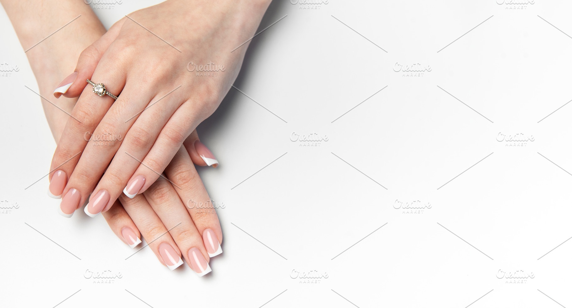 Woman showing french manicure and elegant ring on white backgrou, a Beauty & Fashion Photo by Olena Rudo