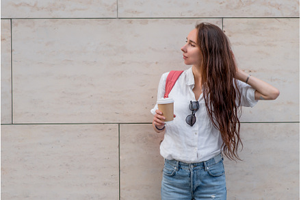 Beautiful woman holds cup coffee her