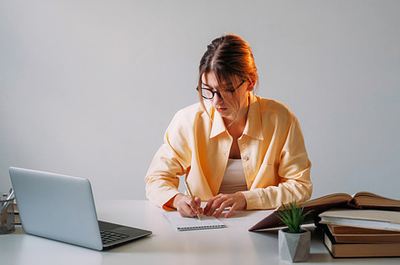 Home education notebook writing focused woman, a Person Photo by Photo Drive Studio